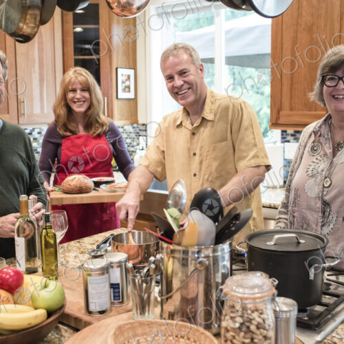 Two senior couples getting together for a dinner party.