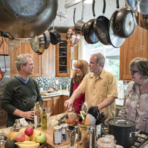 Two senior couples getting together for a dinner party.