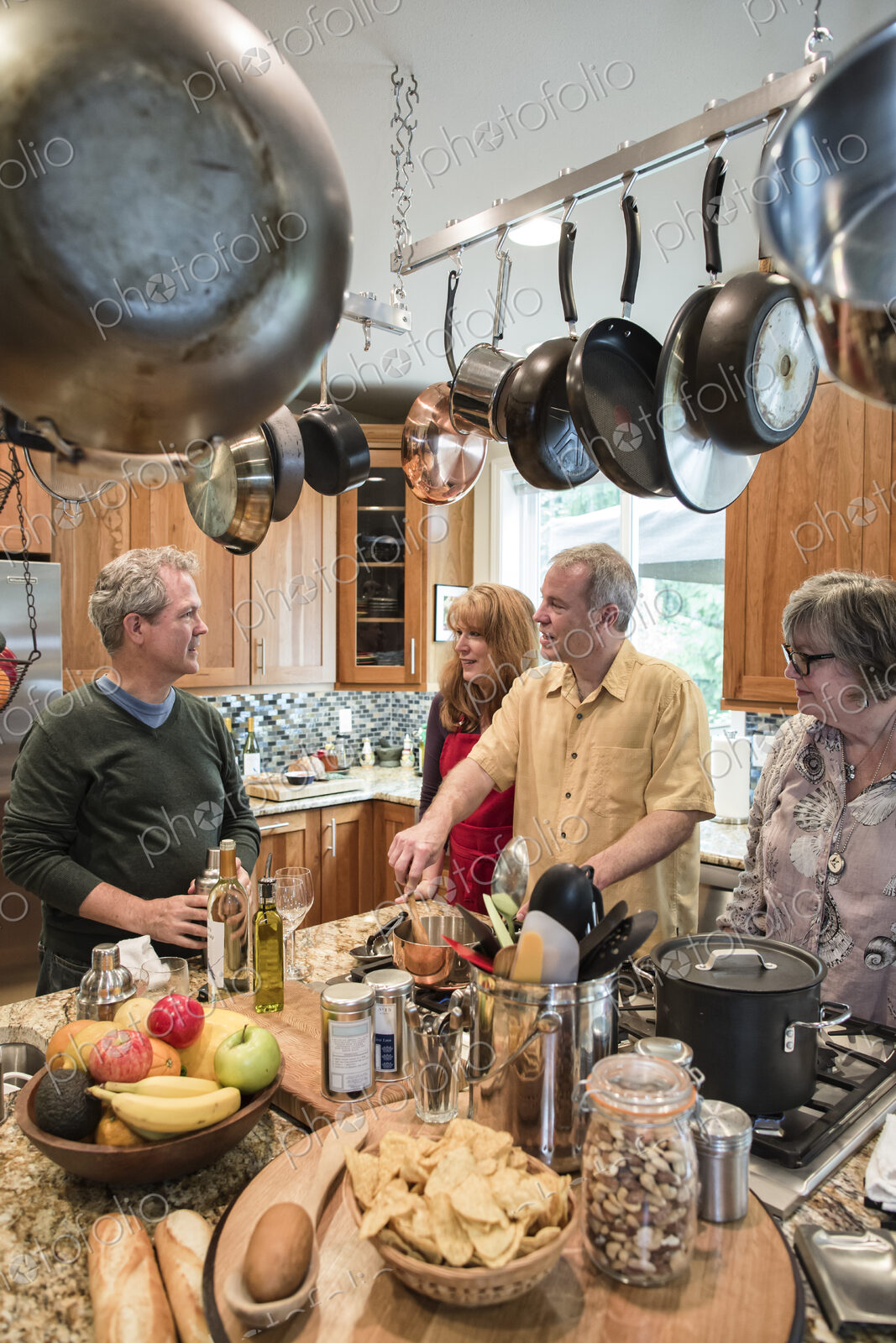 Two senior couples getting together for a dinner party.