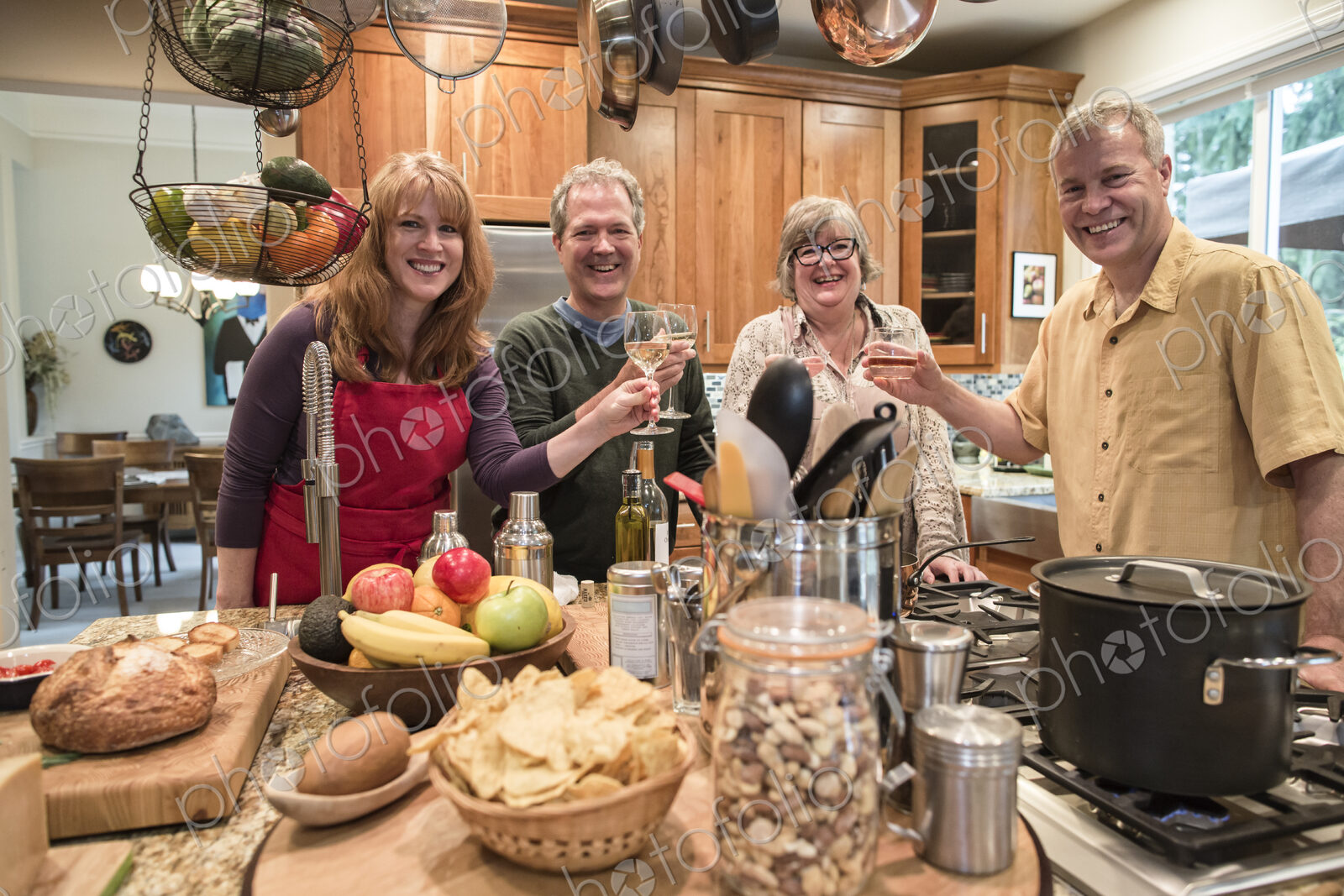 Two senior couples getting together for a dinner party.