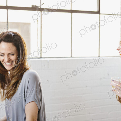 Two women laughing together Two women laughing together