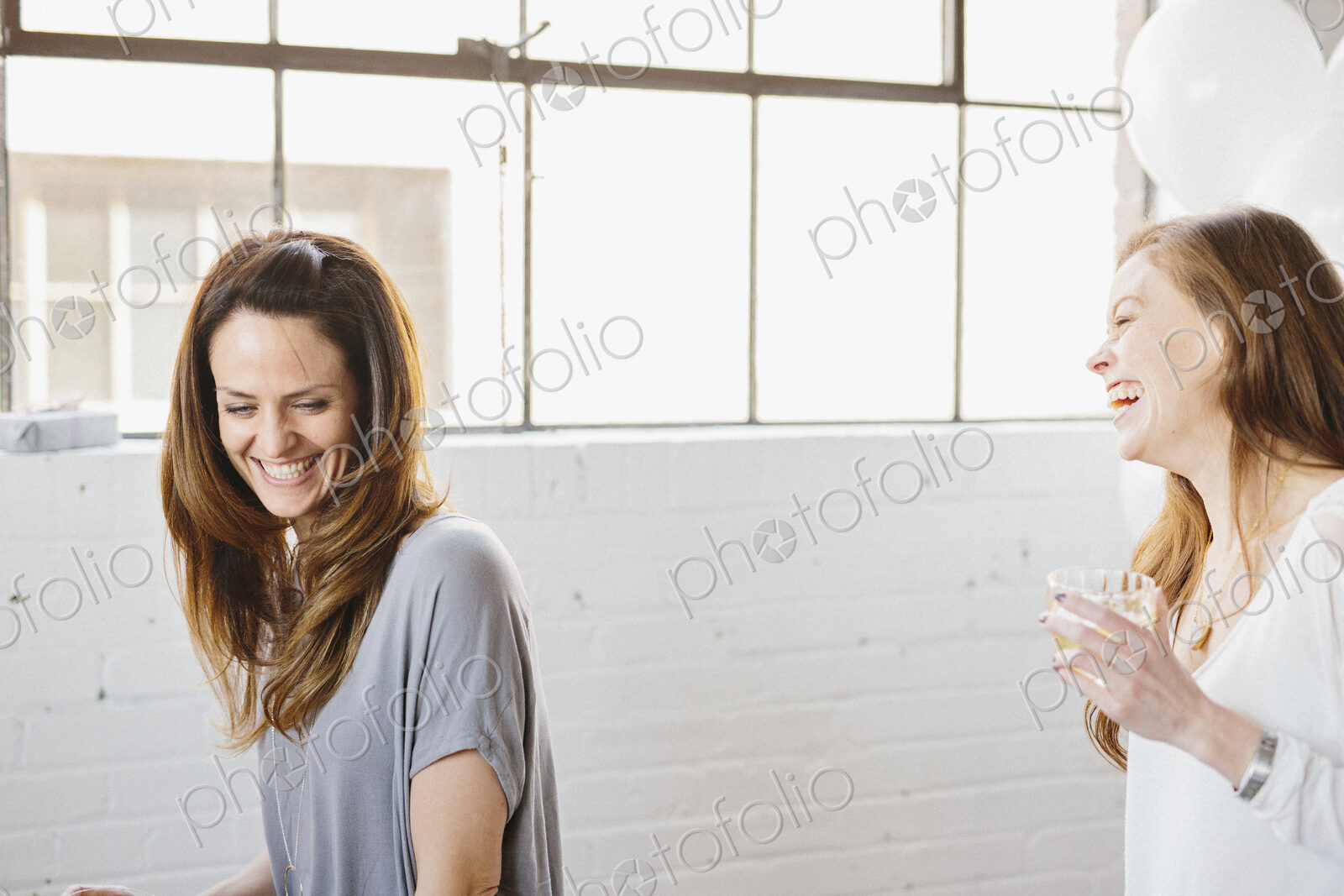 Two women laughing together