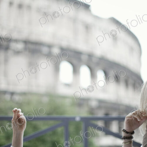 Two women seated on a terrace overlooking the huge Roman amphitheatre building, the… Two women seated on a terrace overlooking the huge Roman amphitheatre building, the…
