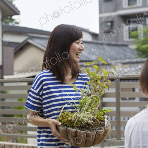Two women standing in a garden.