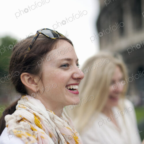 Two women standing outside the Colosseum Roman amphitheatre in Rome, side by side.… Two women standing outside the Colosseum Roman amphitheatre in Rome, side by side.…