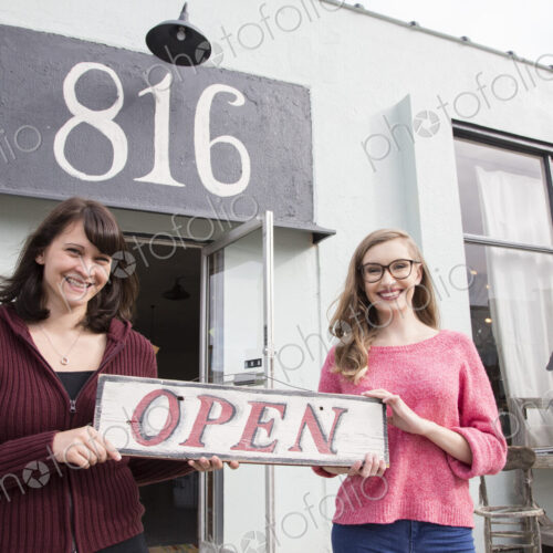 Two young caucasian women owners of a new antique store. Two young caucasian women owners of a new antique store.