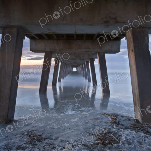 Tybee Island near Savannah, Tybee Pier at dawn, view of the underneath of the pier… Tybee Island near Savannah, Tybee Pier at dawn, view of the underneath of the pier…