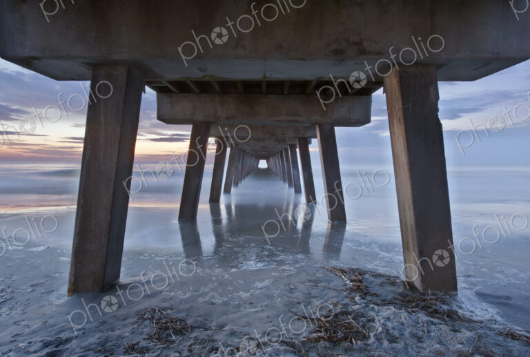 Tybee Island near Savannah, Tybee Pier at dawn, view of the underneath of the pier…