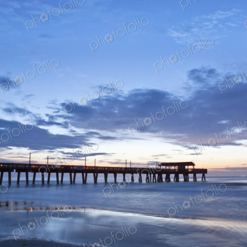 Tybee Island, view of the Tybee Pier reaching out into the sea at dawn Tybee Island, view of the Tybee Pier reaching out into the sea at dawn
