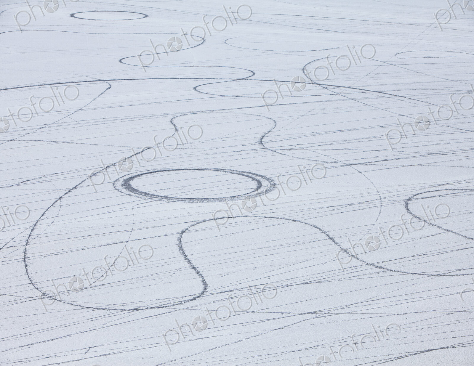Tyre marks and tracks in the playa salt pan surface of Black Rock Desert, Nevada.
