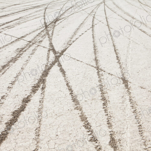 Tyre marks and tracks in the playa salt pan surface of Black Rock Desert, Nevada. Tyre marks and tracks in the playa salt pan surface of Black Rock Desert, Nevada.