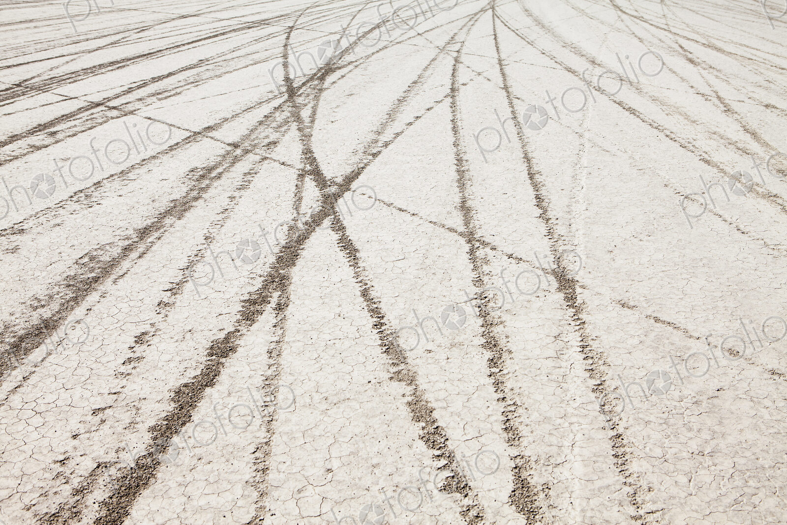 Tyre marks and tracks in the playa salt pan surface of Black Rock Desert, Nevada.