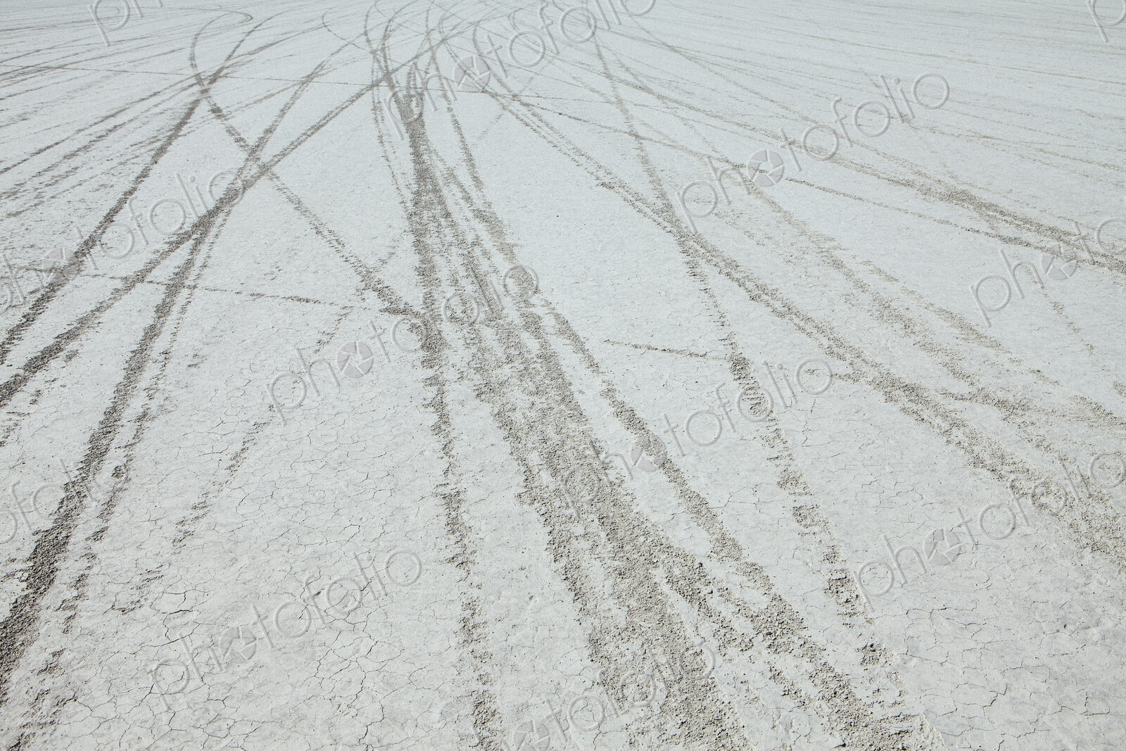Tyre marks and tracks in the playa salt pan surface of Black Rock Desert, Nevada.