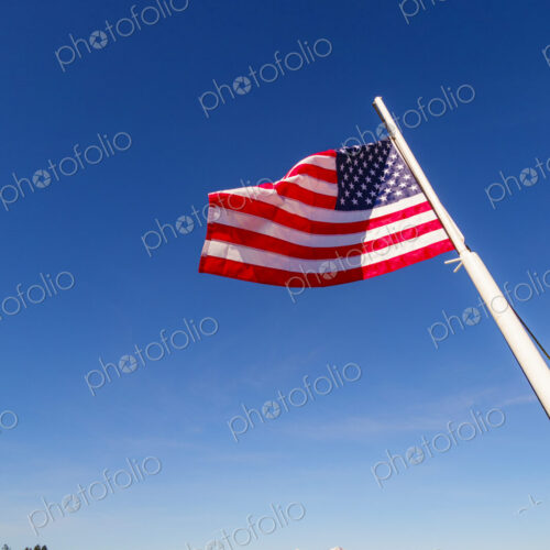 US Flag on flag pole, Hood Canal, WA USA