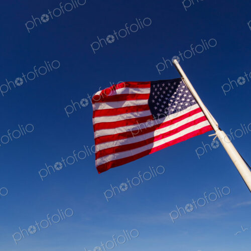 US Flag on flag pole, Hood Canal, WA USA