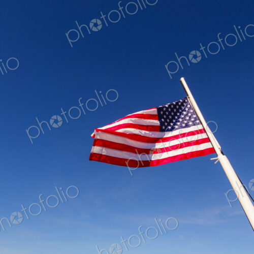 US Flag on flag pole, Hood Canal, WA USA