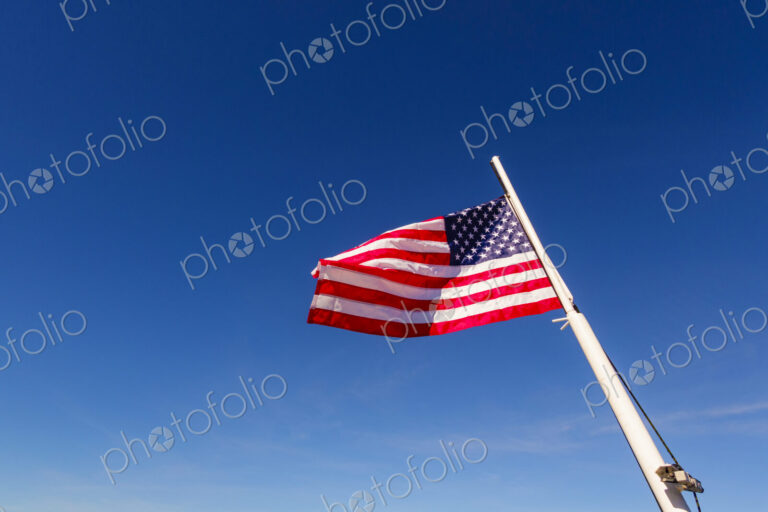 US Flag on flag pole, Hood Canal, WA USA