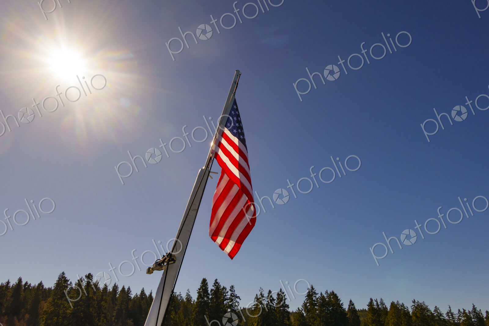 US Flag on flag pole, Hood Canal, WA USA