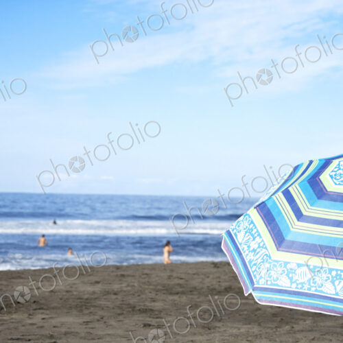Umbrella on beach under blue sky Umbrella on beach under blue sky