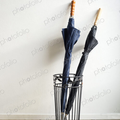 Umbrellas in wire stand