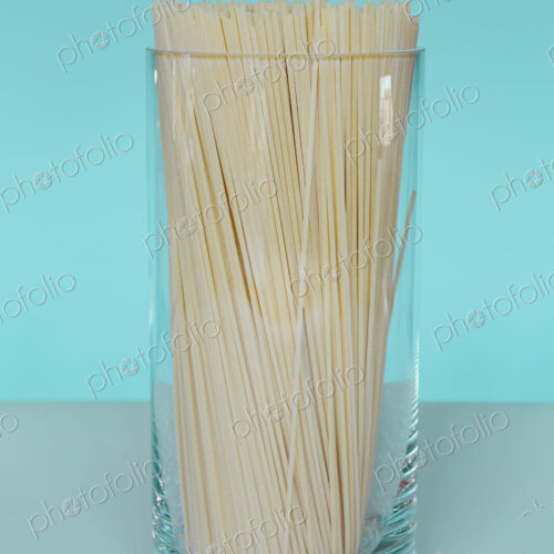 Uncooked organic pasta noodles in glass vase. Spaghetti noodles made of organic durum… Uncooked organic pasta noodles in glass vase. Spaghetti noodles made of organic durum…