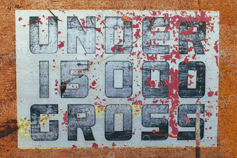 Under 15000 Gross sign painted on side of old truck