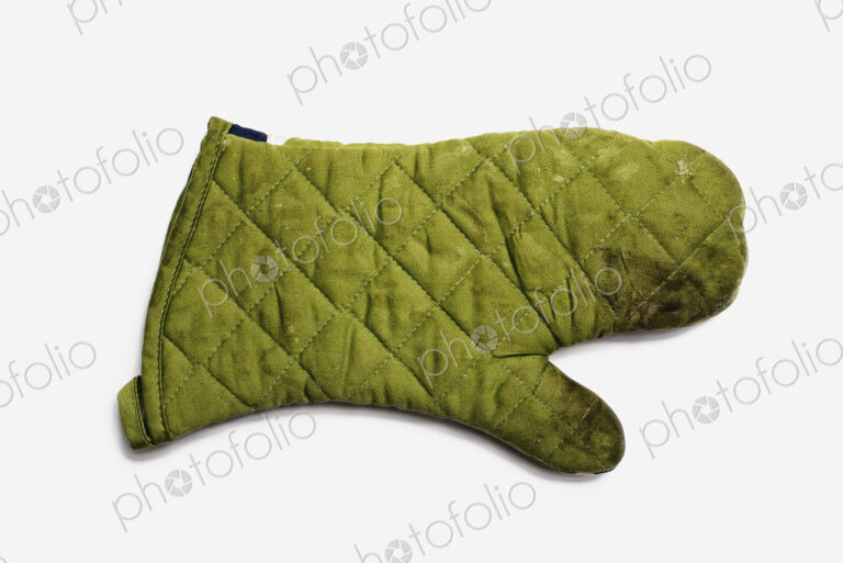 Used Oven Mitt. A quilted padded fabric, green, heat resistant mitt.