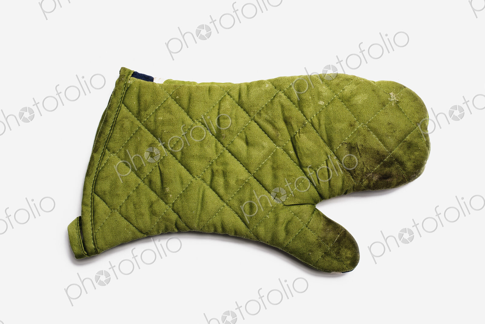 Used Oven Mitt. A quilted padded fabric, green, heat resistant mitt.