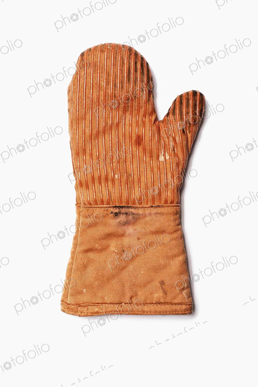Used Oven Mitt. An orange fabric heat resistant mitt.