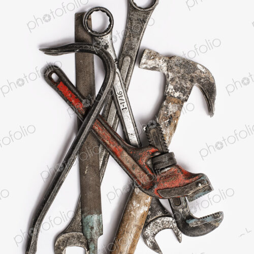 Used Tools. A group of spanners, adjustable wrench and hammer. Worn marked metal… Used Tools. A group of spanners, adjustable wrench and hammer. Worn marked metal…