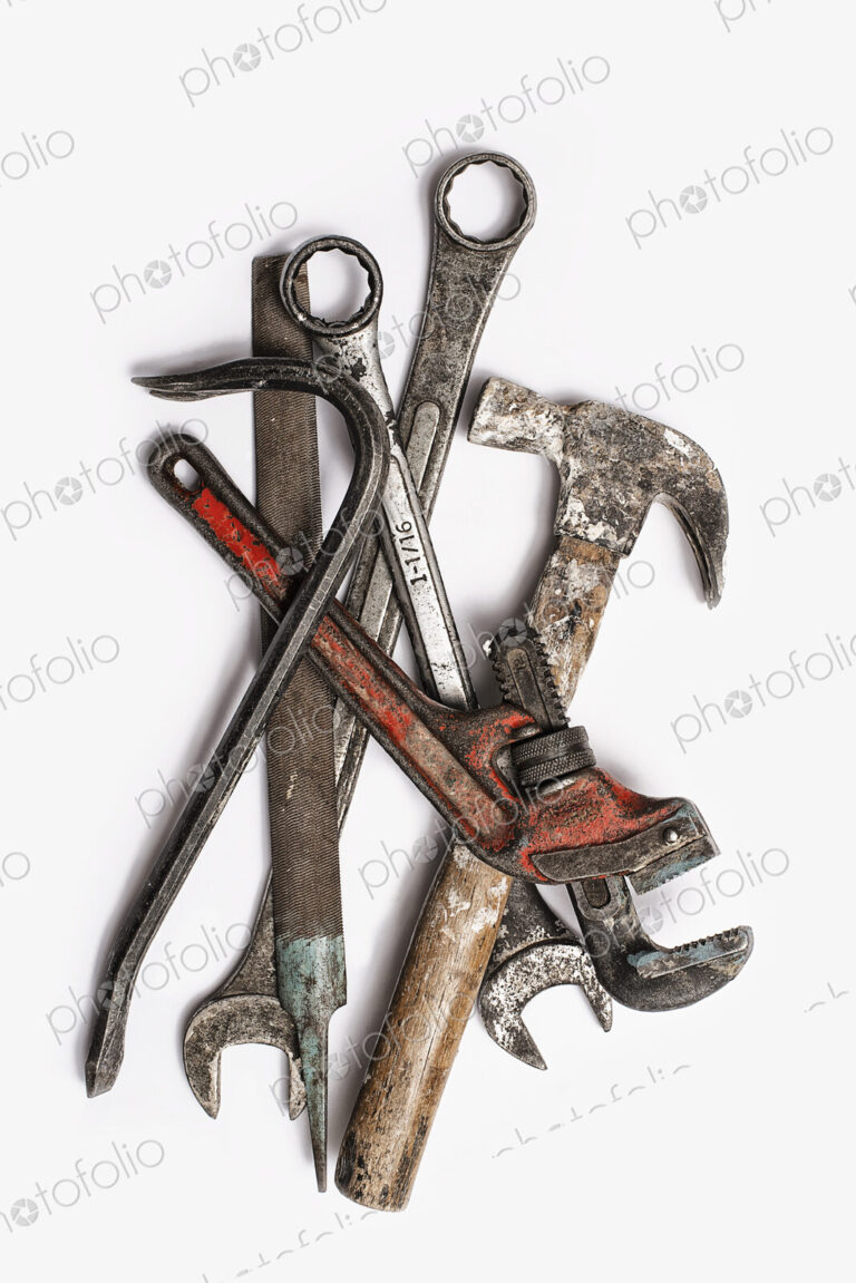 Used Tools. A group of spanners, adjustable wrench and hammer. Worn marked metal…