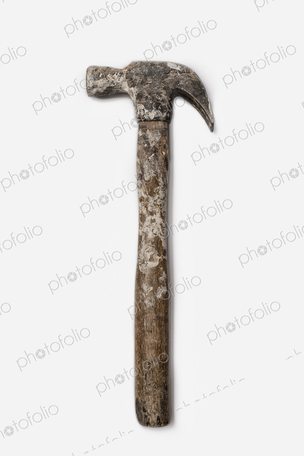 Used Tools. A metal hammer with claw head. A worn marked wooden handle.