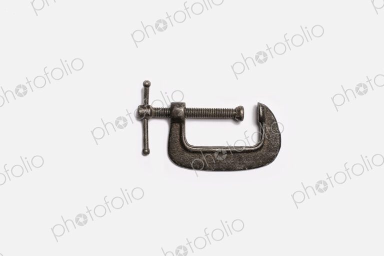 Used Tools. An adjustable clamp.