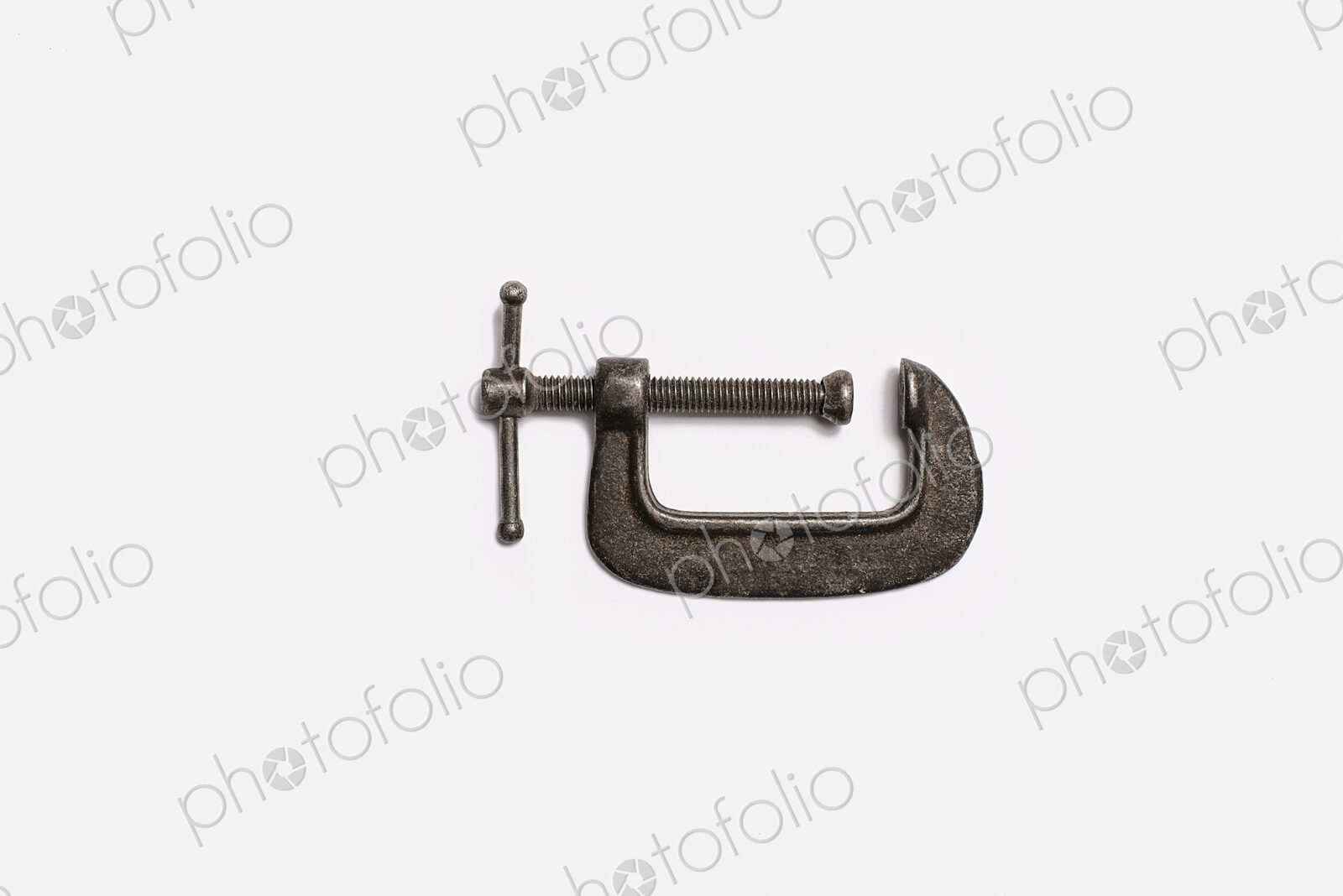 Used Tools. An adjustable clamp.