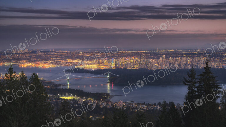Vancouver city lit up at dawn.