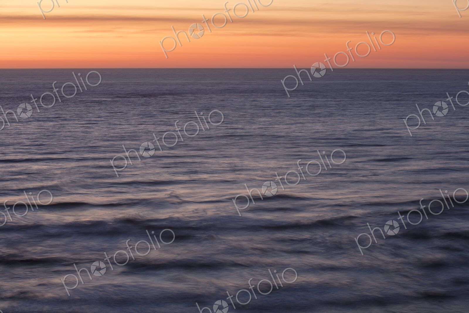 Vast ocean and sky at dusk