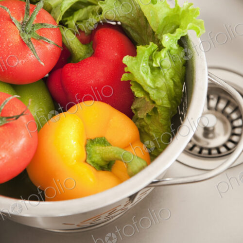 Vegetables in Colander, fresh washed in a sink Vegetables in Colander, fresh washed in a sink