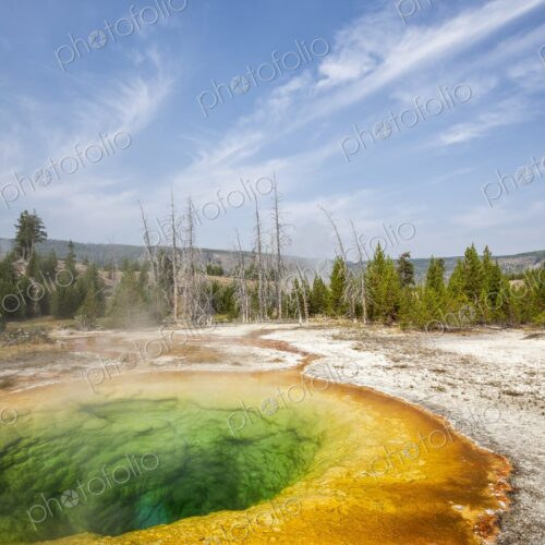 Vibrant colors of Morning Glory Pool in Yellowstone's Upper Geyser Basin, with clear… Vibrant colors of Morning Glory Pool in Yellowstone's Upper Geyser Basin, with clear…