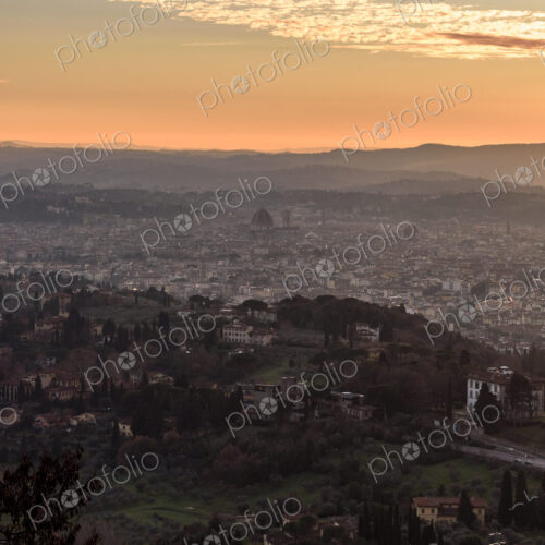 View across Florence city at sunset from above, outlines of city landmarks. View across Florence city at sunset from above, outlines of city landmarks.