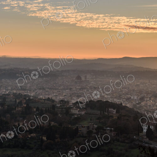 View across Florence city at sunset from above, outlines of city landmarks. View across Florence city at sunset from above, outlines of city landmarks.
