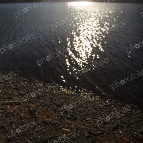 View across Lake Crescent, Olympic National Park, at dusk, reflections of sunlight… View across Lake Crescent, Olympic National Park, at dusk, reflections of sunlight…