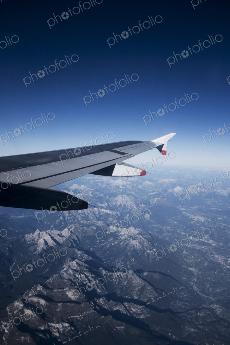 View across the Alps seen from a passenger plane window.