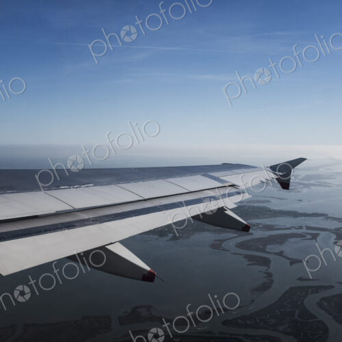 View across the Venice lagoon seen from a passenger plane window, Veneto, Italy.