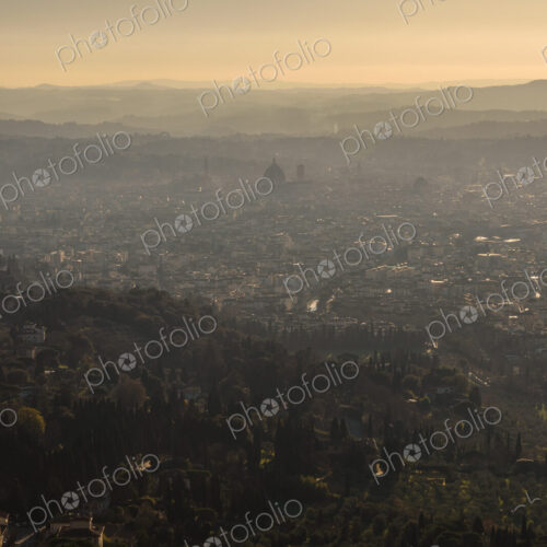 View across the city of Florence at sunset. View across the city of Florence at sunset.