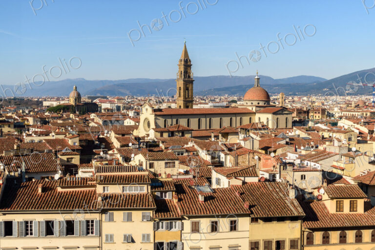 View across the rooftops of Florence, historic renaissance architectural landmarks,…