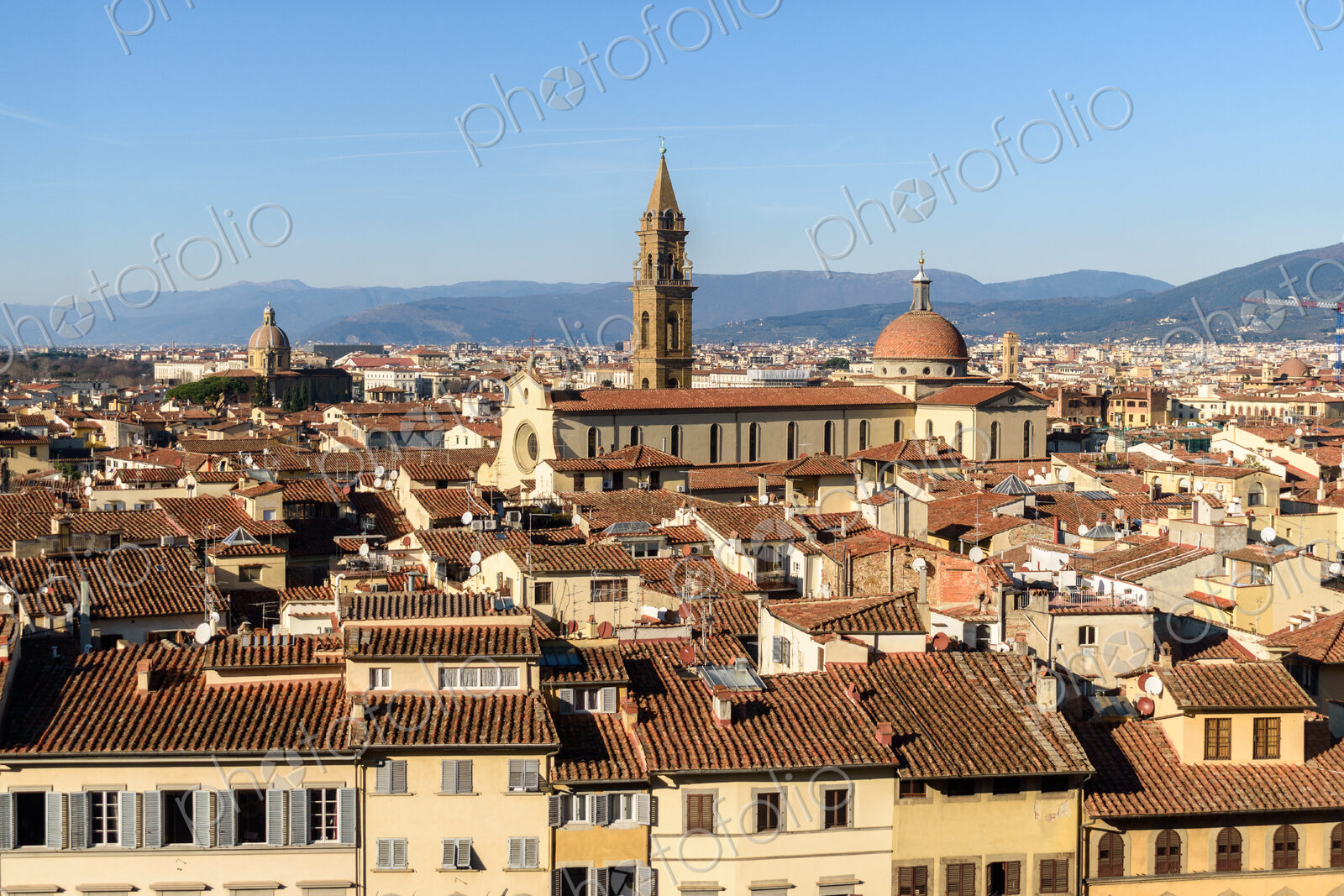 View across the rooftops of Florence, historic renaissance architectural landmarks,…