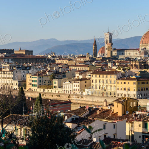 View across the rooftops of Florence, historic renaissance architectural landmarks,…