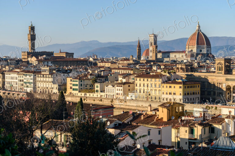 View across the rooftops of Florence, historic renaissance architectural landmarks,…
