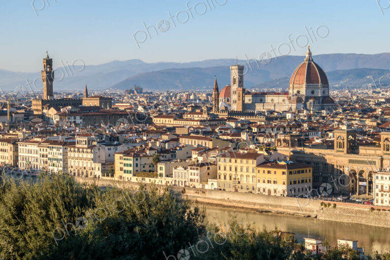 View across the rooftops of Florence, historic renaissance architectural landmarks,…