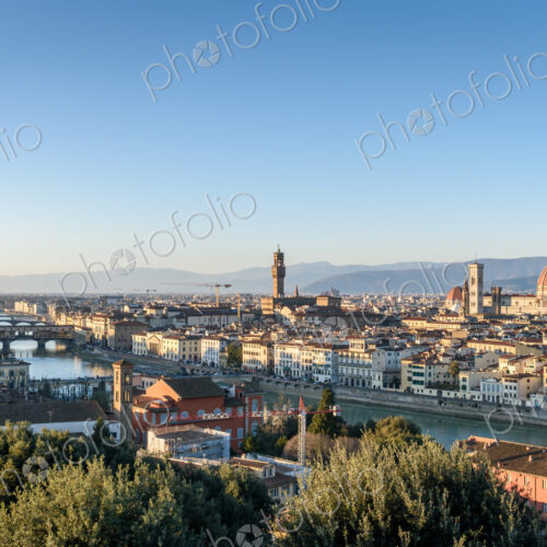 View across the rooftops of Florence, historic renaissance architectural landmarks,…